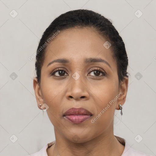 Joyful latino adult female with short  brown hair and brown eyes