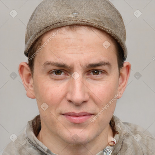 Joyful white adult male with short  brown hair and grey eyes