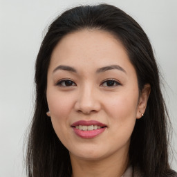 Joyful asian young-adult female with long  brown hair and brown eyes