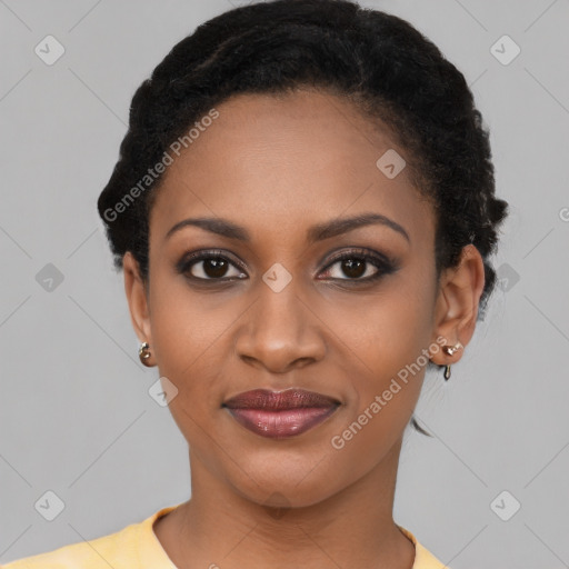 Joyful black young-adult female with short  black hair and brown eyes