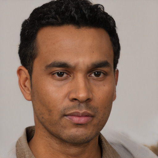 Neutral latino young-adult male with short  brown hair and brown eyes