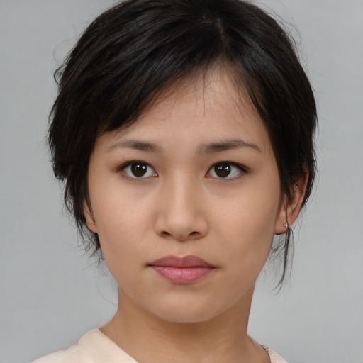 Neutral asian young-adult female with medium  brown hair and brown eyes