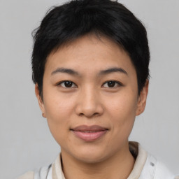 Joyful asian young-adult female with short  brown hair and brown eyes