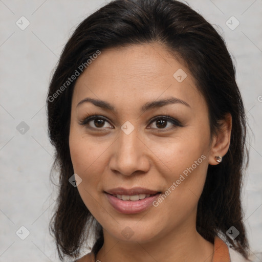 Joyful latino young-adult female with medium  brown hair and brown eyes