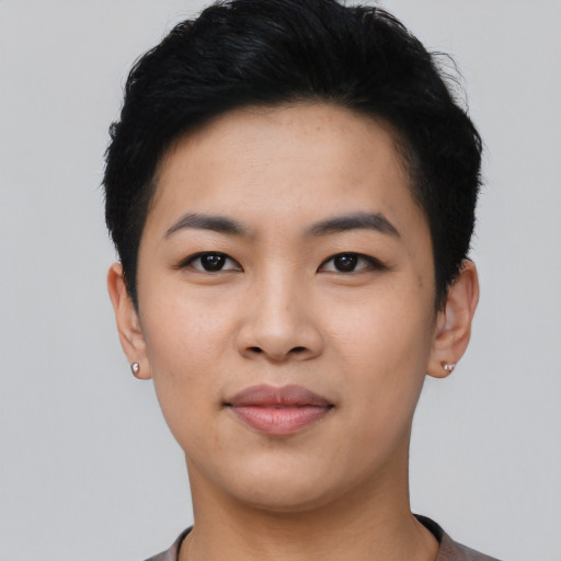 Joyful asian young-adult female with short  black hair and brown eyes