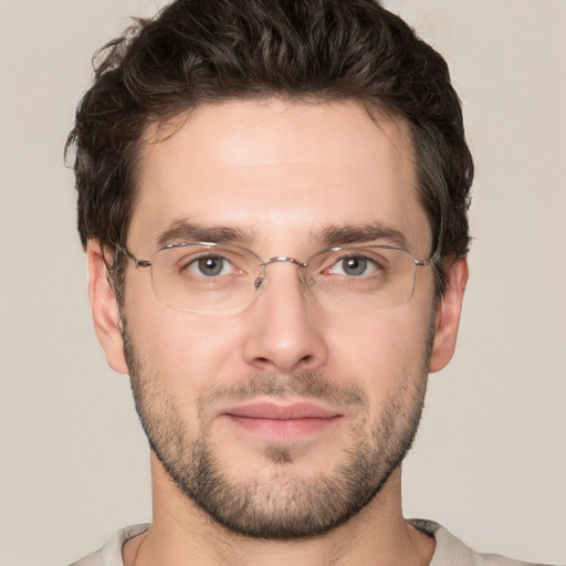 Joyful white adult male with short  brown hair and grey eyes