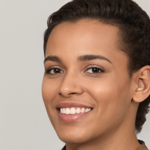 Joyful white young-adult female with short  brown hair and brown eyes