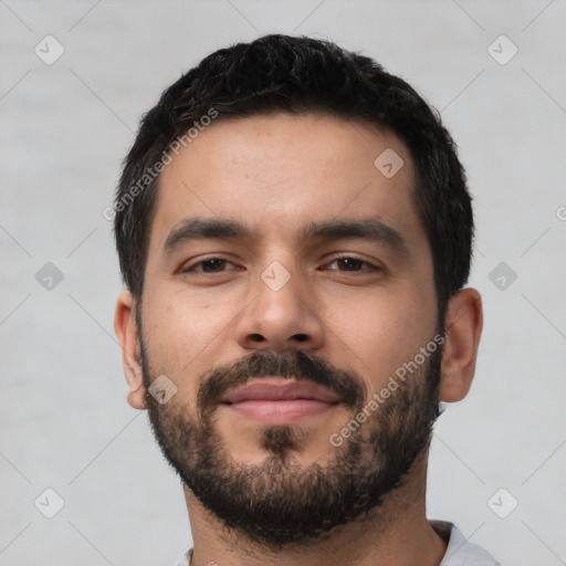 Neutral latino young-adult male with short  black hair and brown eyes