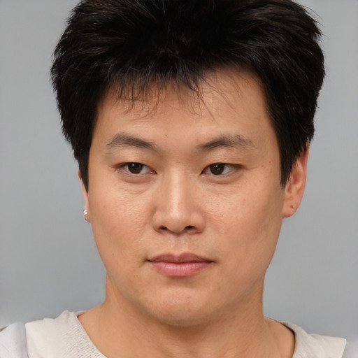 Neutral asian young-adult male with short  brown hair and brown eyes
