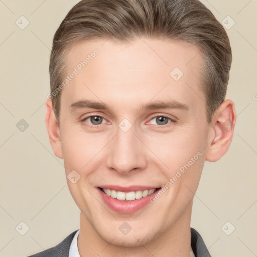 Joyful white young-adult male with short  brown hair and grey eyes