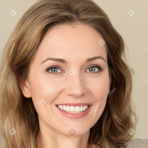 Joyful white young-adult female with medium  brown hair and green eyes