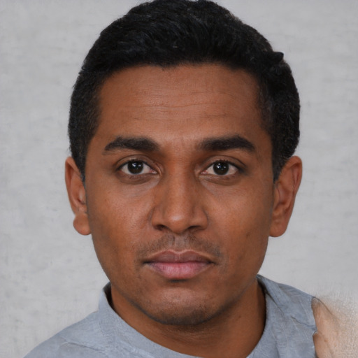 Neutral black young-adult male with short  black hair and brown eyes