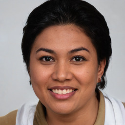 Joyful white young-adult female with medium  brown hair and brown eyes