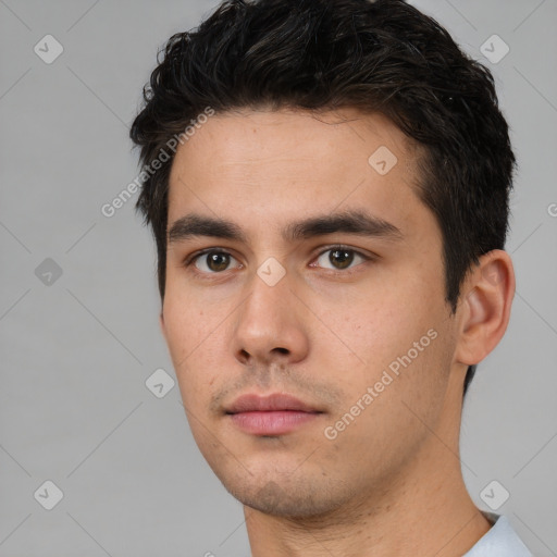 Neutral white young-adult male with short  black hair and brown eyes