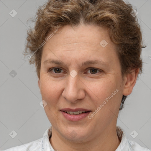 Joyful white adult female with short  brown hair and brown eyes