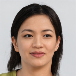 Joyful asian young-adult female with medium  brown hair and brown eyes