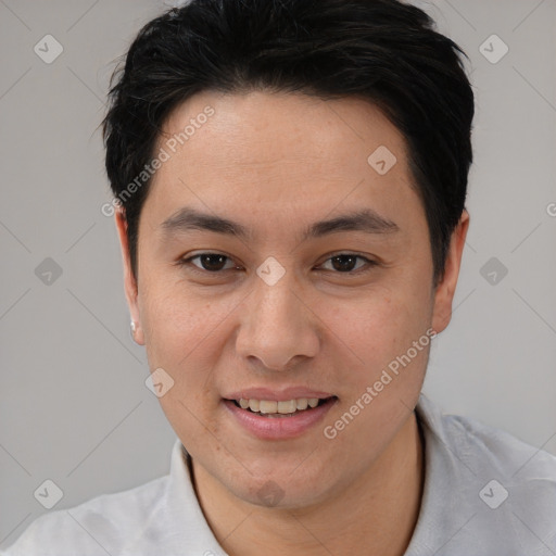 Joyful asian young-adult male with short  black hair and brown eyes