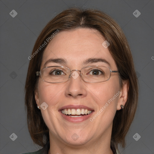 Joyful white adult female with medium  brown hair and blue eyes