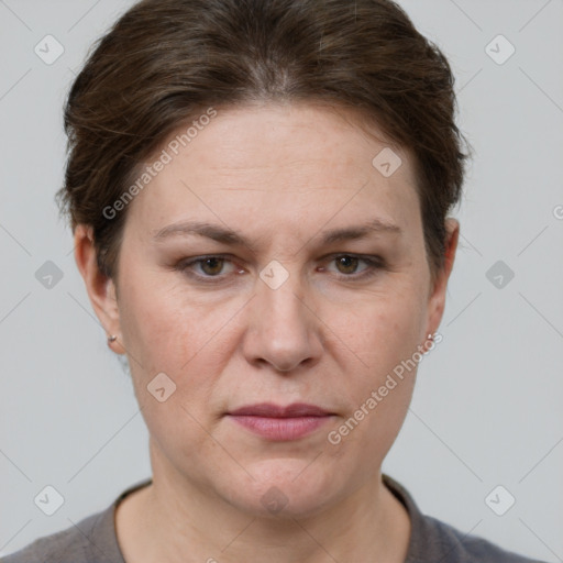 Joyful white adult female with short  brown hair and grey eyes