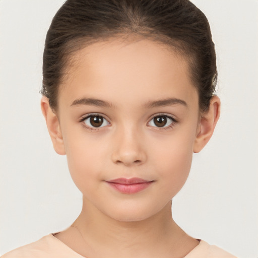 Joyful white child female with short  brown hair and brown eyes