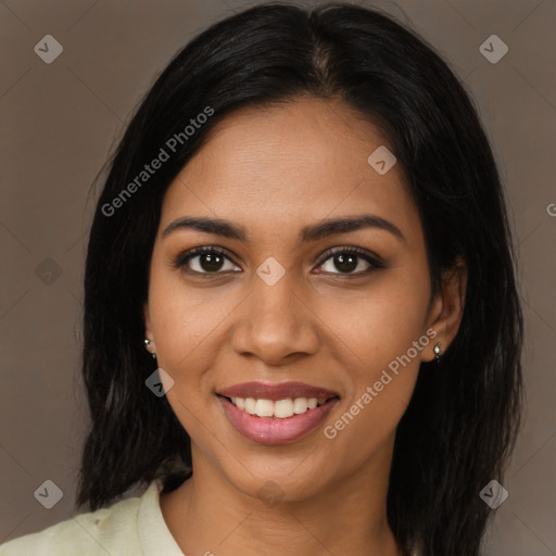 Joyful latino young-adult female with long  black hair and brown eyes