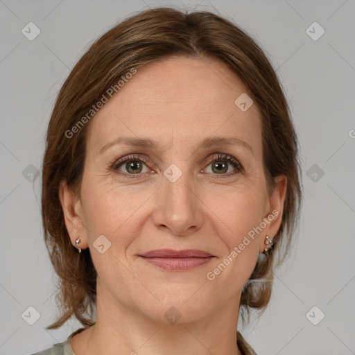 Joyful white adult female with medium  brown hair and brown eyes