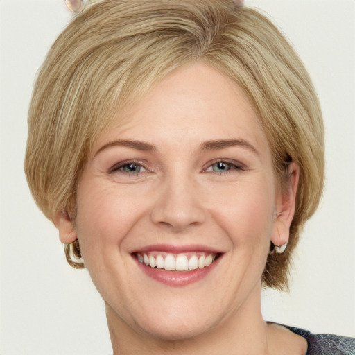 Joyful white young-adult female with medium  brown hair and blue eyes