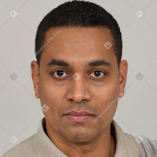 Neutral latino young-adult male with short  black hair and brown eyes
