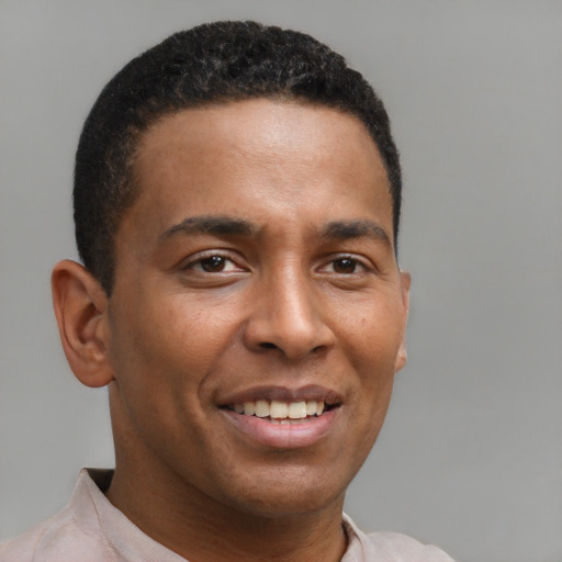 Joyful latino young-adult male with short  brown hair and brown eyes