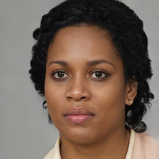 Neutral black young-adult female with medium  black hair and brown eyes