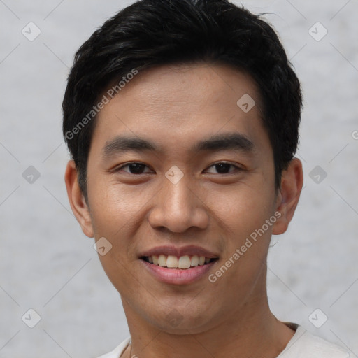 Joyful asian young-adult male with short  black hair and brown eyes