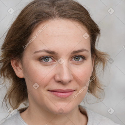 Joyful white young-adult female with medium  brown hair and blue eyes