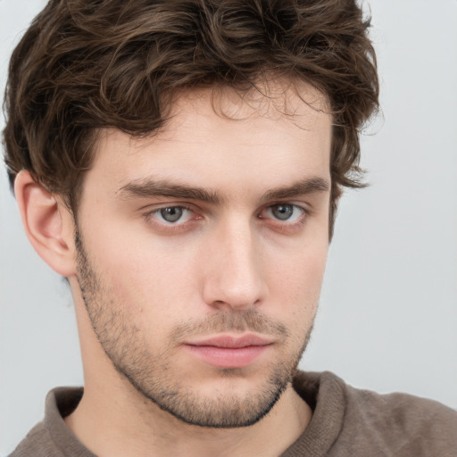 Neutral white young-adult male with short  brown hair and grey eyes