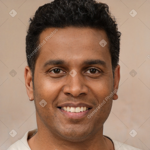 Joyful latino young-adult male with short  brown hair and brown eyes