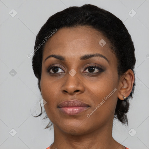 Joyful black young-adult female with medium  black hair and brown eyes
