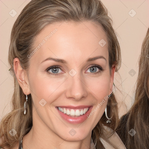 Joyful white young-adult female with long  brown hair and grey eyes