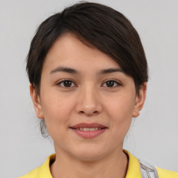 Joyful asian young-adult female with medium  brown hair and brown eyes