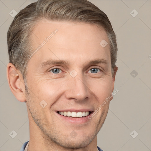 Joyful white adult male with short  brown hair and grey eyes