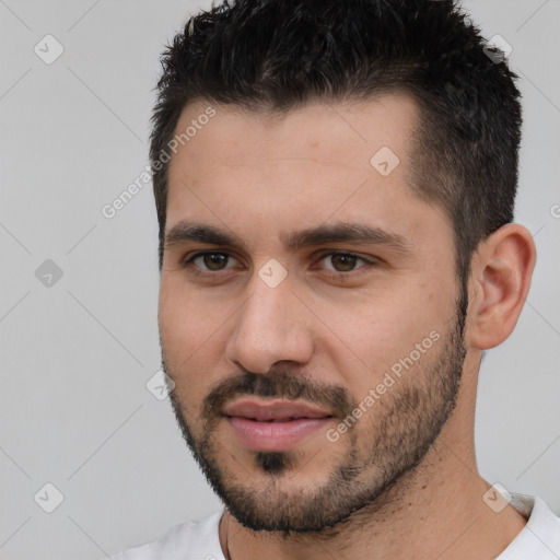 Joyful white young-adult male with short  black hair and brown eyes