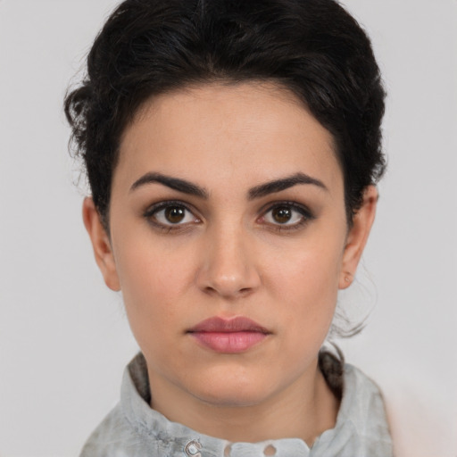 Neutral white young-adult female with short  brown hair and brown eyes