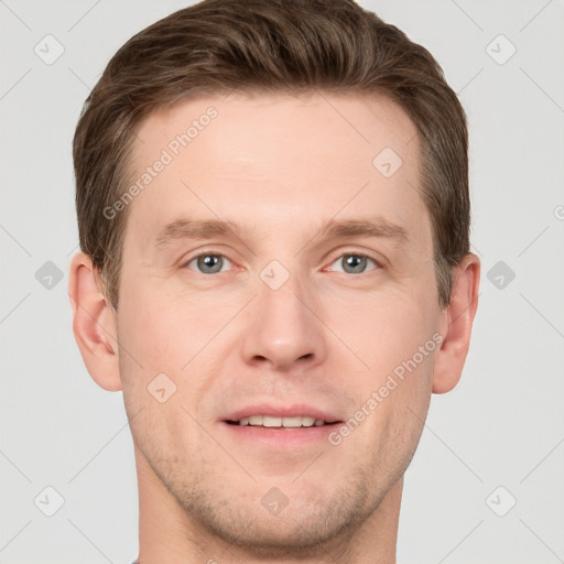 Joyful white adult male with short  brown hair and grey eyes