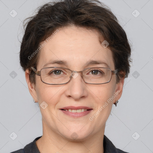 Joyful white adult female with short  brown hair and brown eyes