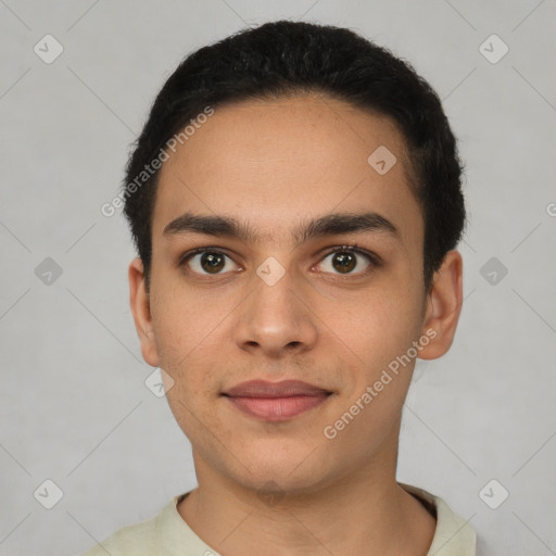 Joyful latino young-adult male with short  black hair and brown eyes