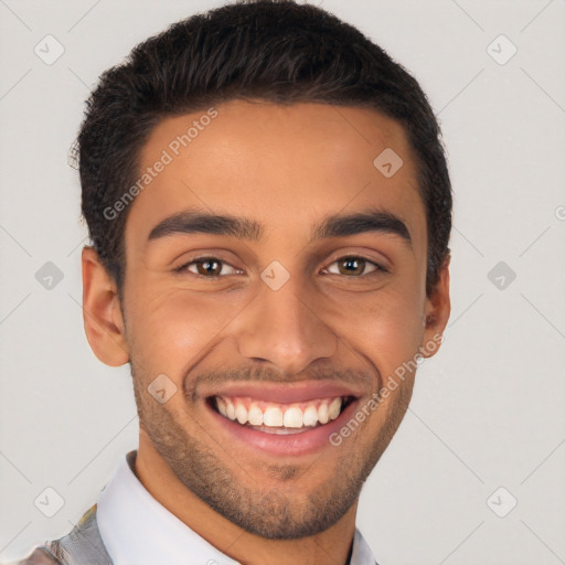 Joyful latino young-adult male with short  black hair and brown eyes