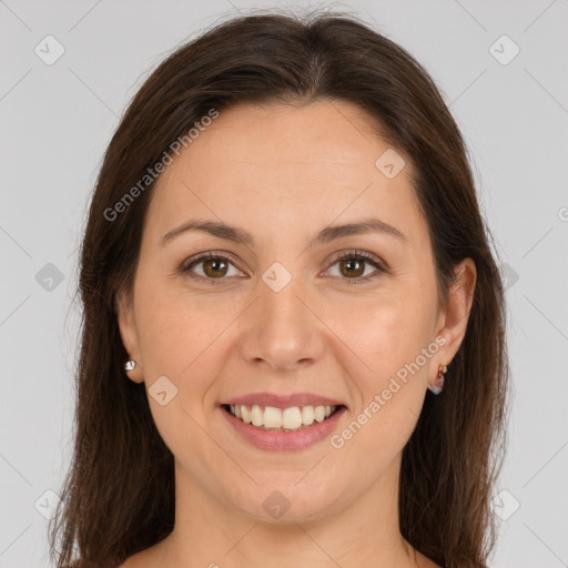 Joyful white young-adult female with long  brown hair and brown eyes