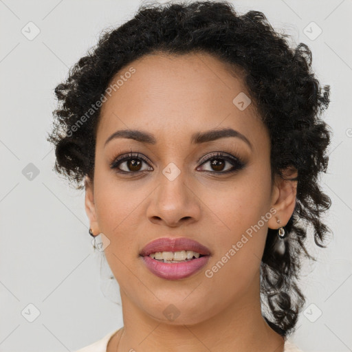 Joyful black young-adult female with short  brown hair and brown eyes