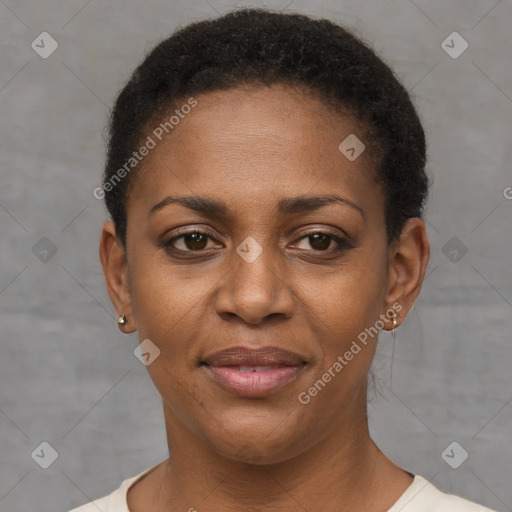 Joyful black young-adult female with short  brown hair and brown eyes