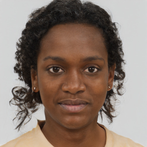 Neutral black young-adult female with medium  brown hair and brown eyes