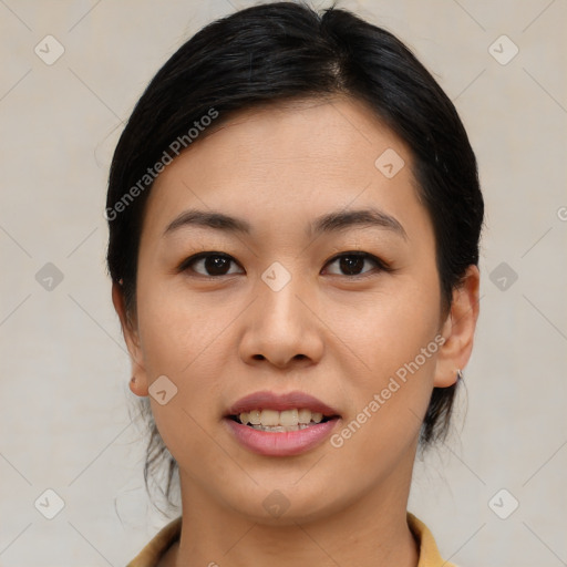 Joyful asian young-adult female with medium  black hair and brown eyes