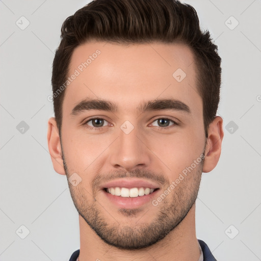 Joyful white young-adult male with short  brown hair and brown eyes